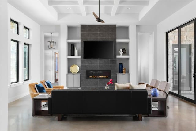 7817 Orisha Dr, Austin, TX 78739 - living area with built in features, coffered ceiling, a tile fireplace, baseboards, and beam ceiling