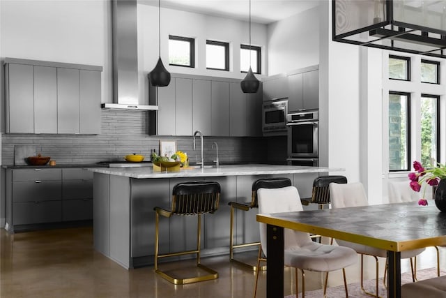 7817 Orisha Dr, Austin, TX 78739 - kitchen with gray cabinets, stainless steel microwave, and modern cabinets