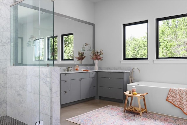 7817 Orisha Dr, Austin, TX 78739 - full bathroom with a stall shower, a freestanding tub, vanity, and a wealth of natural light
