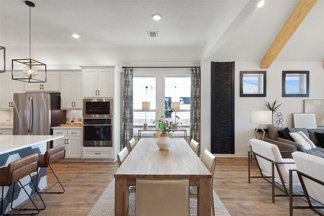 200 Ridgewell Loop, Georgetown, TX 78633 - dining area with beam ceiling, light wood-style flooring, recessed lighting, and baseboards