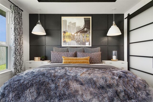 200 Ridgewell Loop, Georgetown, TX 78633 - bedroom featuring a barn door