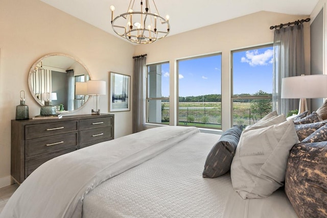 bedroom with an inviting chandelier and vaulted ceiling