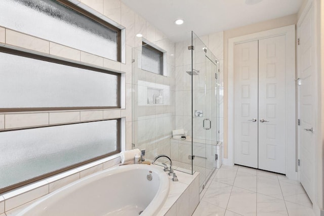 full bath featuring a shower stall, a garden tub, a closet, and recessed lighting