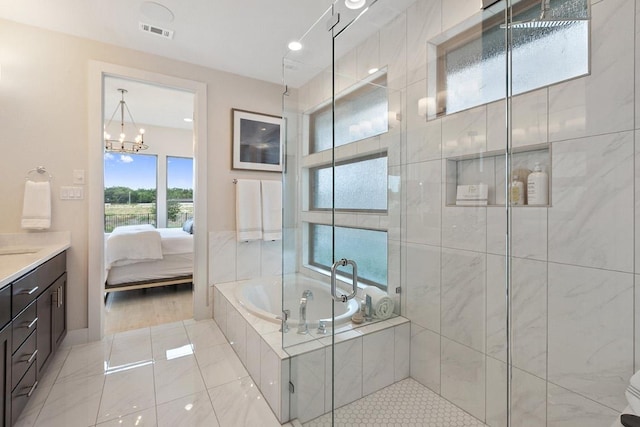 ensuite bathroom featuring a shower stall, tile patterned floors, a garden tub, and visible vents