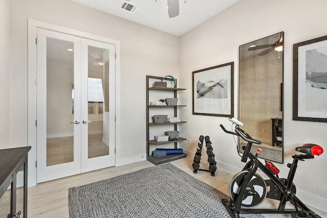 exercise room with french doors, ceiling fan, and wood finished floors