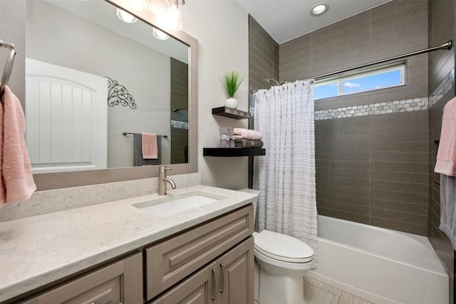 full bath with toilet, vanity, and shower / bath combination with curtain