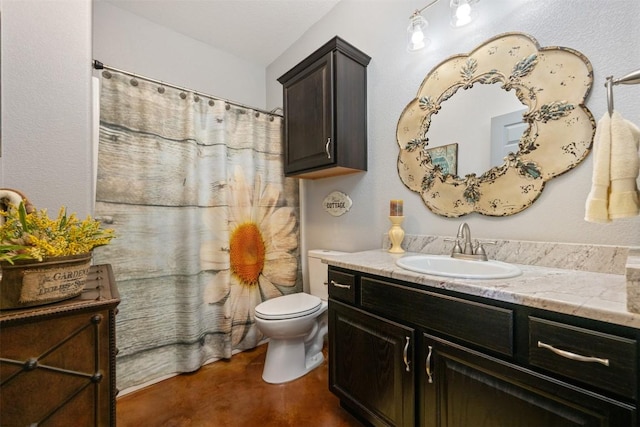 bathroom featuring finished concrete flooring, vanity, a shower with shower curtain, and toilet