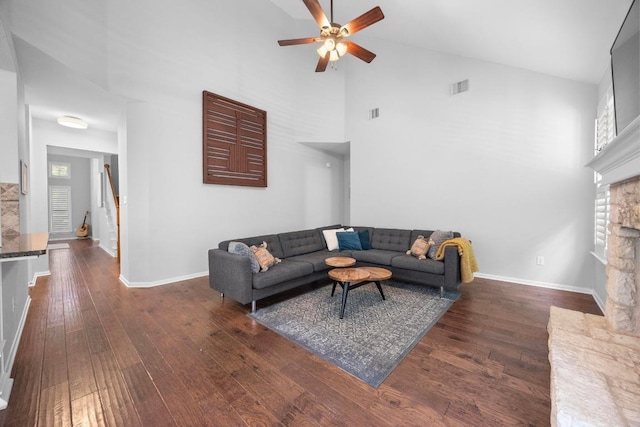 8909 Beatty Ct, Austin, TX 78749 - living room featuring a fireplace, high vaulted ceiling, ceiling fan, wood finished floors, and plenty of natural light