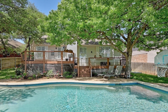 8909 Beatty Ct, Austin, TX 78749 - view of pool featuring stairway, a wooden deck, and a fenced backyard