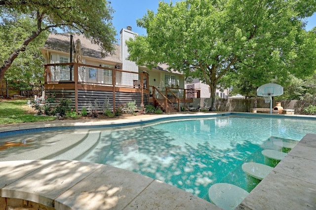 8909 Beatty Ct, Austin, TX 78749 - view of pool featuring stairs, a deck, and a fenced backyard
