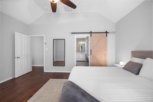8909 Beatty Ct, Austin, TX 78749 - bedroom with vaulted ceiling, a barn door, wood finished floors, ensuite bathroom, and ceiling fan