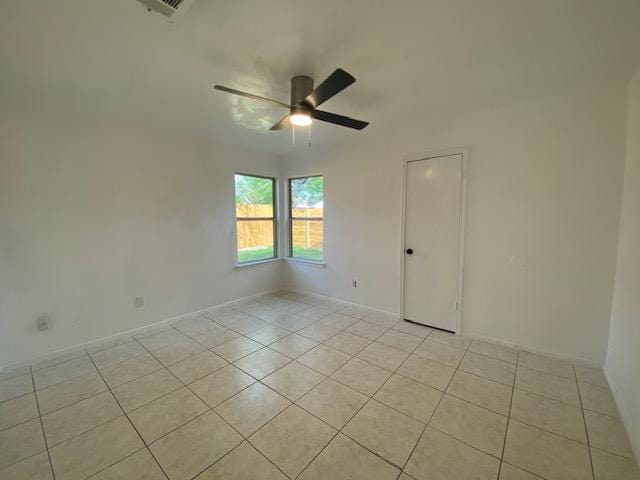 12318 Marogot Run, Austin, TX 78758 - spare room with light tile patterned flooring and a ceiling fan
