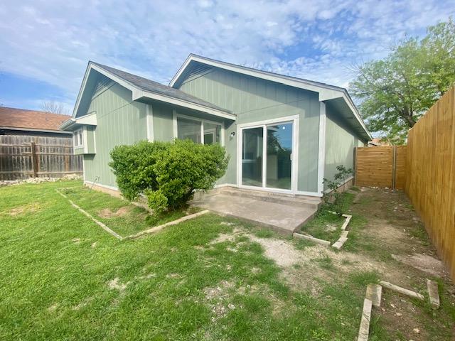12318 Marogot Run, Austin, TX 78758 - rear view of house with a fenced backyard