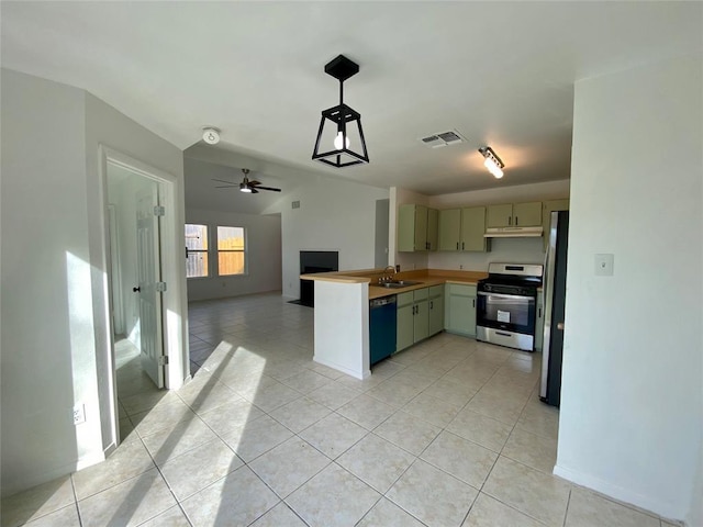 12318 Marogot Run, Austin, TX 78758 - kitchen featuring appliances with stainless steel finishes, under cabinet range hood, a peninsula, open floor plan, and light tile patterned flooring