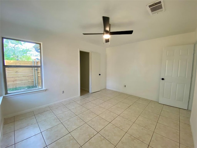 12318 Marogot Run, Austin, TX 78758 - unfurnished room with light tile patterned floors and a ceiling fan