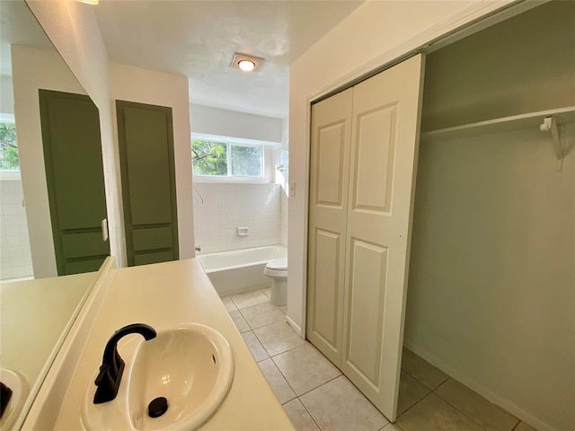 12318 Marogot Run, Austin, TX 78758 - full bathroom featuring a closet, tile patterned floors, a bath, and vanity