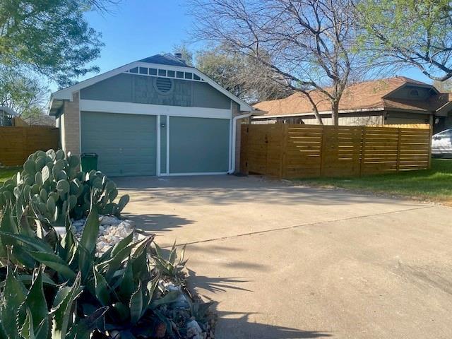 12318 Marogot Run, Austin, TX 78758 - garage featuring concrete driveway