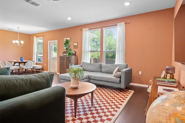 6809 Ellsworth Walk, Austin, TX 78724 - living room featuring a chandelier, dark wood-style flooring, and recessed lighting