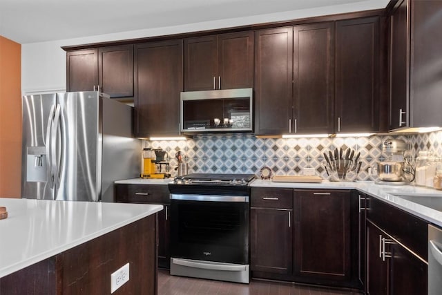 6809 Ellsworth Walk, Austin, TX 78724 - kitchen featuring appliances with stainless steel finishes, light countertops, backsplash, and dark brown cabinetry