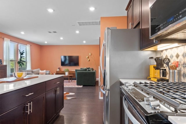 6809 Ellsworth Walk, Austin, TX 78724 - kitchen with stainless steel appliances, tasteful backsplash, open floor plan, light countertops, and recessed lighting