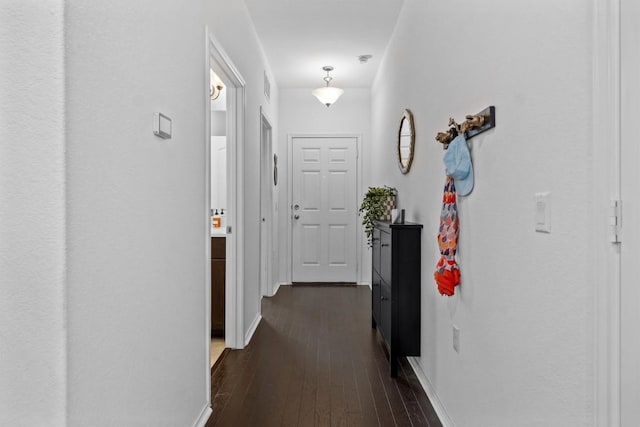 6809 Ellsworth Walk, Austin, TX 78724 - hallway with dark wood finished floors and baseboards
