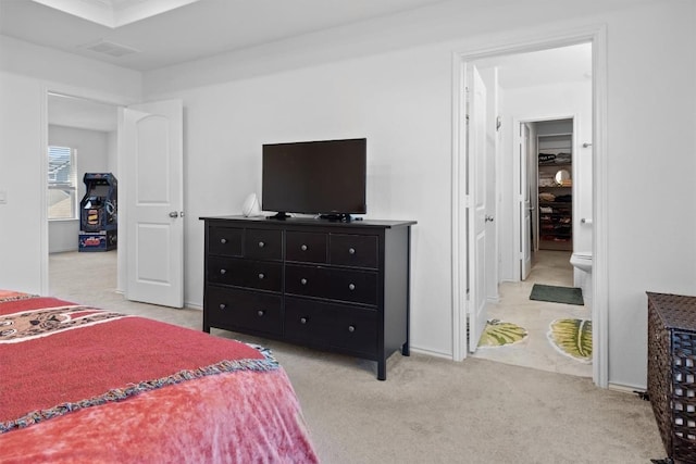 6809 Ellsworth Walk, Austin, TX 78724 - bedroom with light colored carpet and ensuite bathroom