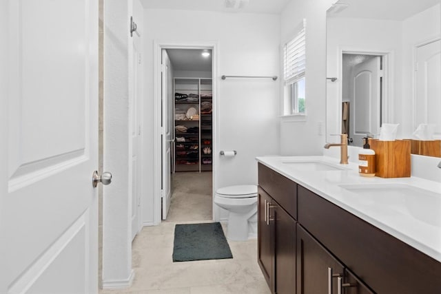 6809 Ellsworth Walk, Austin, TX 78724 - bathroom featuring double vanity and a spacious closet