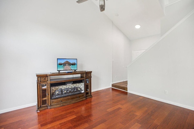 339 Liberty St, Hutto, TX 78634 - living area featuring wood finished floors, stairway, ceiling fan, recessed lighting, and high vaulted ceiling