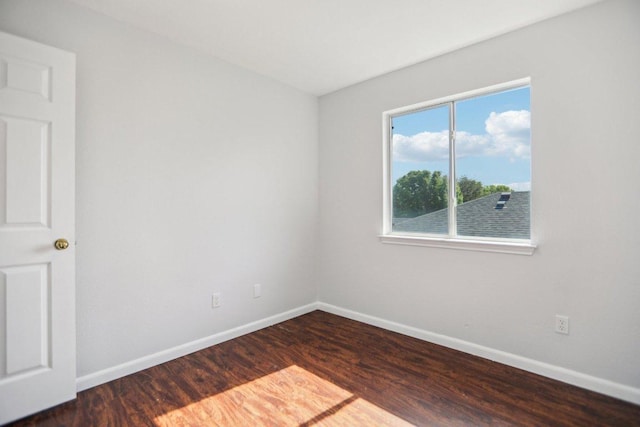 339 Liberty St, Hutto, TX 78634 - spare room featuring wood finished floors and baseboards
