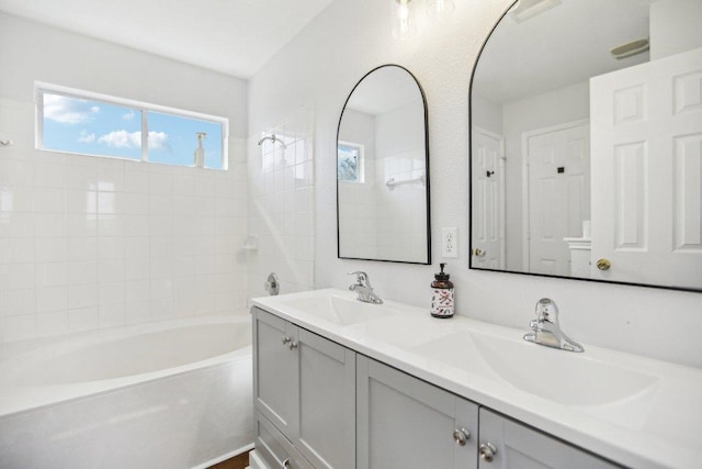 339 Liberty St, Hutto, TX 78634 - full bath with double vanity and shower / washtub combination