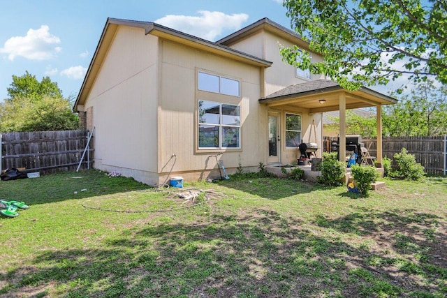 339 Liberty St, Hutto, TX 78634 - rear view of house featuring a fenced backyard and a patio