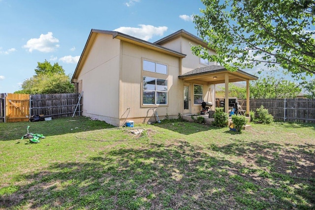339 Liberty St, Hutto, TX 78634 - rear view of property with a fenced backyard and a patio area