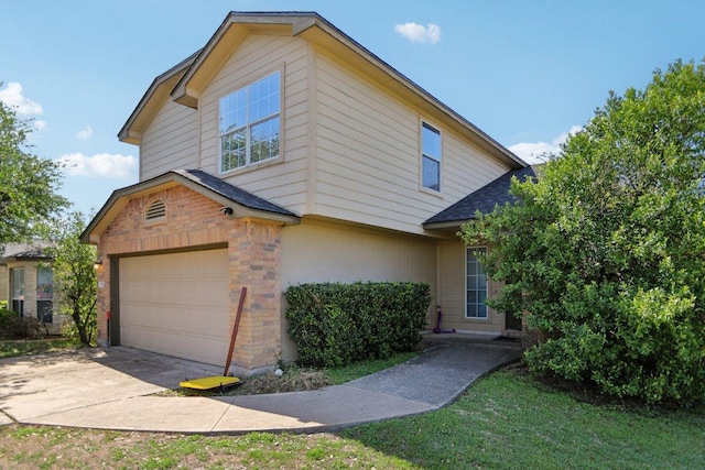 339 Liberty St, Hutto, TX 78634 - view of front of house with brick siding, roof with shingles, concrete driveway, and an attached garage