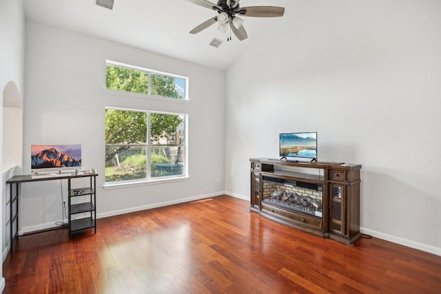 339 Liberty St, Hutto, TX 78634 - office space with healthy amount of natural light, ceiling fan, wood finished floors, high vaulted ceiling, and arched walkways