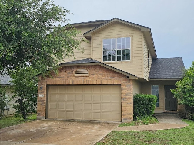 339 Liberty St, Hutto, TX 78634 - view of front of house with brick siding, concrete driveway, and roof with shingles