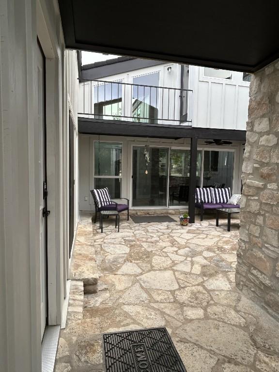 438 Eagle, Lakeway, TX 78734 - rear view of property with a patio area and a balcony