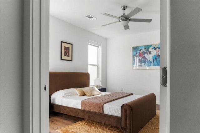 4801 Springdale Rd Unit 1107, Austin, TX 78723 - bedroom with wood finished floors and a ceiling fan