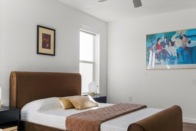 4801 Springdale Rd Unit 1107, Austin, TX 78723 - bedroom with wood finished floors, a ceiling fan, and baseboards