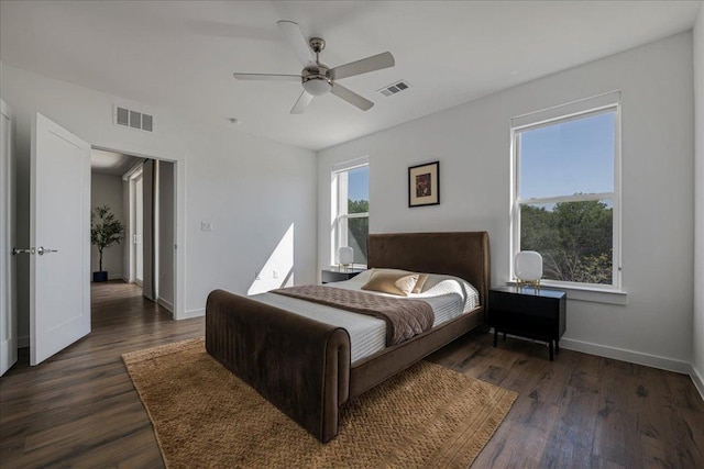 4801 Springdale Rd Unit 1107, Austin, TX 78723 - bedroom with wood finished floors, baseboards, and ceiling fan