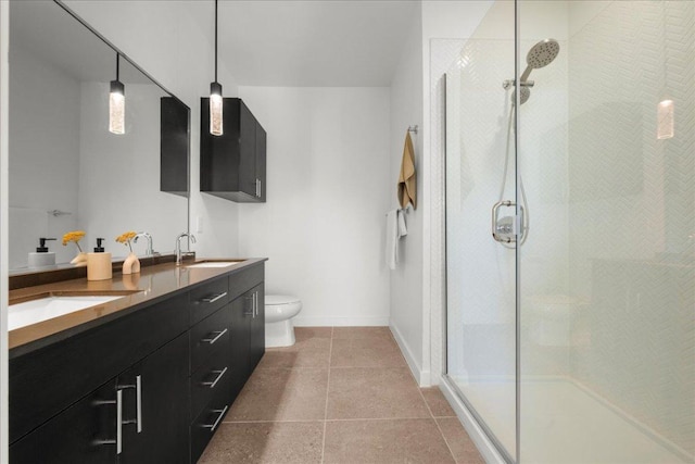 bathroom with toilet, an enclosed shower, and a sink