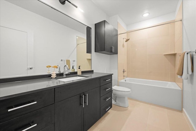 full bathroom with toilet, tile patterned floors, vanity, and shower / washtub combination