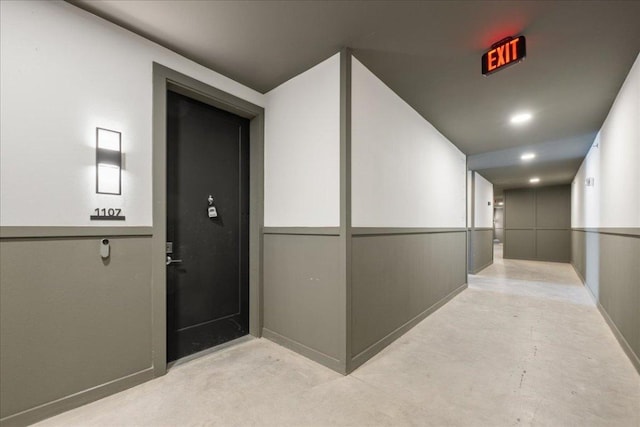 hallway with concrete flooring