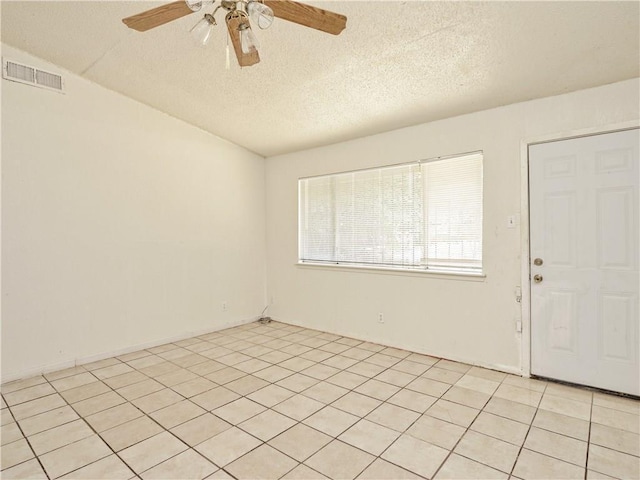 6916 Carwill Dr, Austin, TX 78724 - empty room featuring ceiling fan, a textured ceiling, and light tile patterned flooring