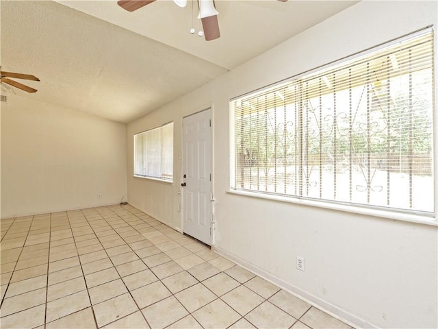 6916 Carwill Dr, Austin, TX 78724 - entrance foyer with a ceiling fan, tile patterned flooring, and vaulted ceiling
