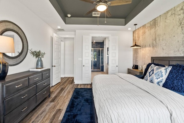 328 Ridgewell Loop, Georgetown, TX 78633 - bedroom featuring wood finished floors, baseboards, a tray ceiling, recessed lighting, and a ceiling fan