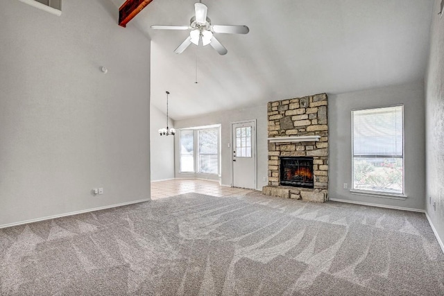 2109 Delvin Ln, Austin, TX 78728 - unfurnished living room featuring a ceiling fan, carpet, a fireplace, and a chandelier
