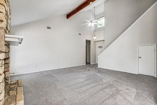 2109 Delvin Ln, Austin, TX 78728 - unfurnished living room featuring high vaulted ceiling, carpet floors, ceiling fan, beam ceiling, and a stone fireplace