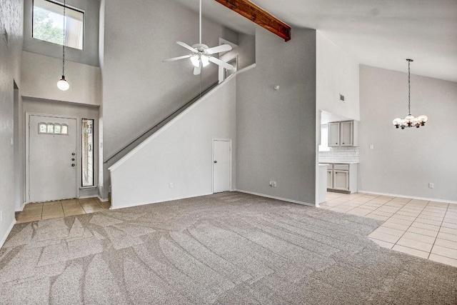 2109 Delvin Ln, Austin, TX 78728 - unfurnished living room with high vaulted ceiling, light tile patterned floors, ceiling fan, a chandelier, and light carpet