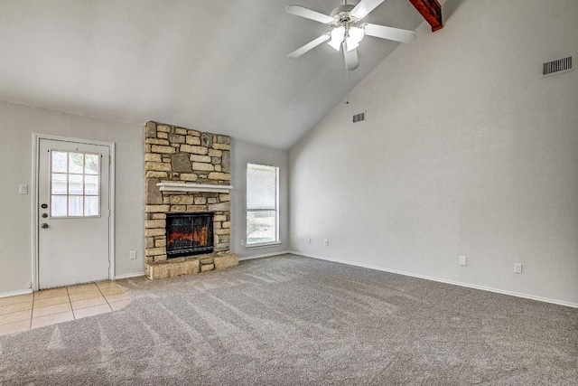 2109 Delvin Ln, Austin, TX 78728 - unfurnished living room with carpet flooring, a ceiling fan, a stone fireplace, baseboards, and high vaulted ceiling