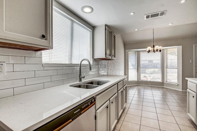 2109 Delvin Ln, Austin, TX 78728 - kitchen with a sink, stainless steel dishwasher, tasteful backsplash, light countertops, and a chandelier